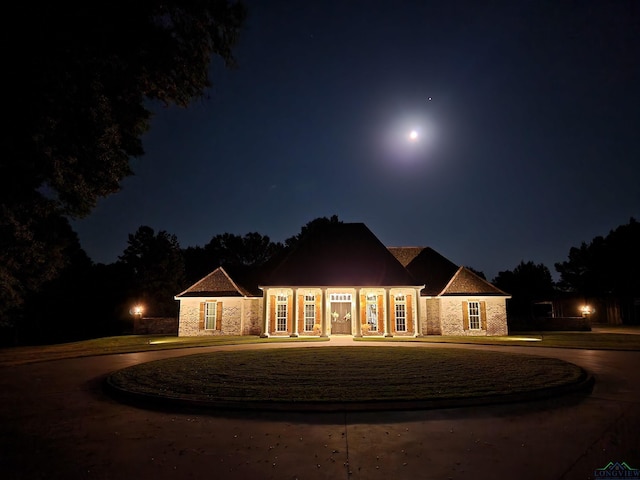 1882 County Road 3000, Joaquin, TX 75954 - single story home featuring stone siding and curved driveway
