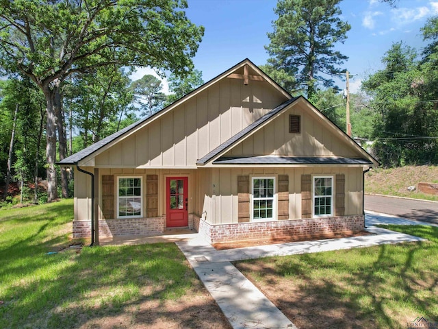 view of front of house with a front lawn and a porch