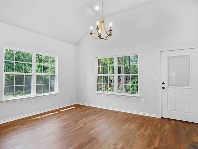 interior space with a notable chandelier, dark hardwood / wood-style flooring, and high vaulted ceiling