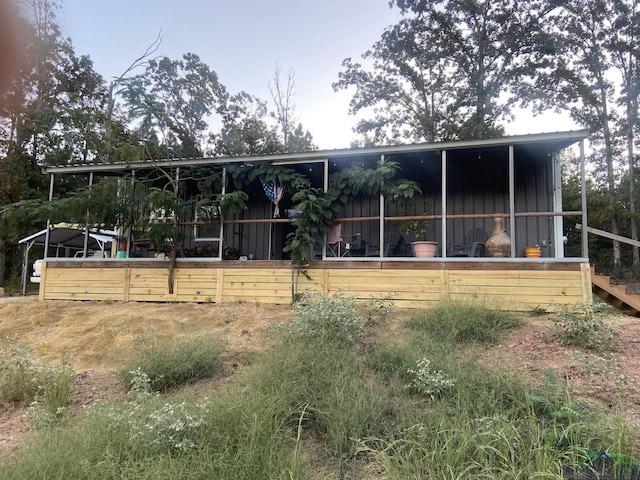 back of house with an outdoor structure