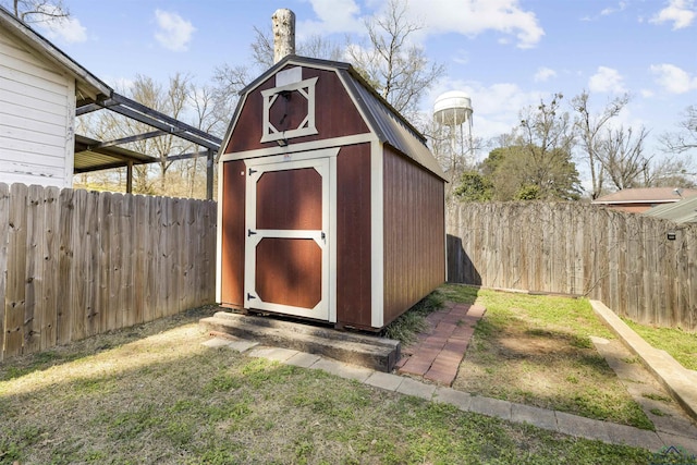 view of shed with a fenced backyard