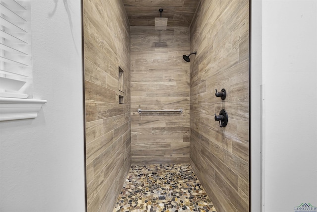 full bath with a tile shower