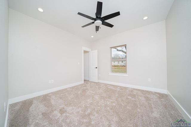 carpeted empty room with ceiling fan