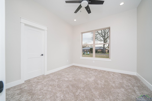 carpeted empty room with ceiling fan