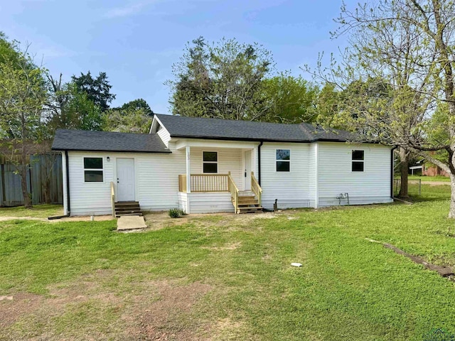 103 W Nandina St, Ore City, TX 75683 - back of property with entry steps and roof with shingles