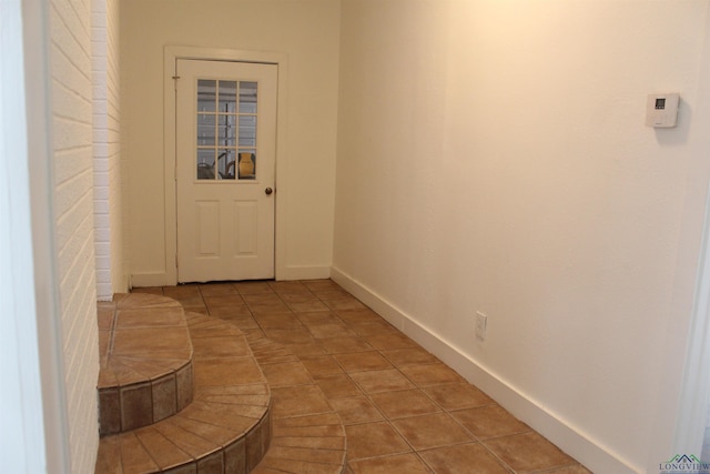 corridor with light tile patterned flooring