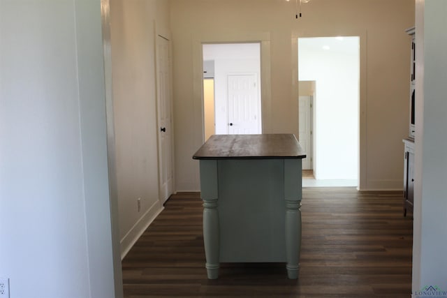 hall with dark hardwood / wood-style floors