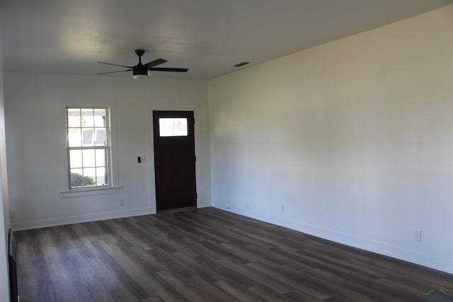 entrance foyer with ceiling fan and dark wood-type flooring