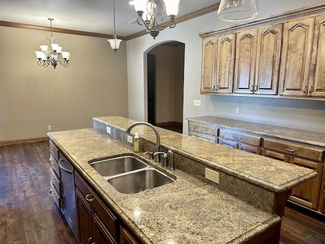 kitchen with a center island, crown molding, sink, dark hardwood / wood-style flooring, and a chandelier