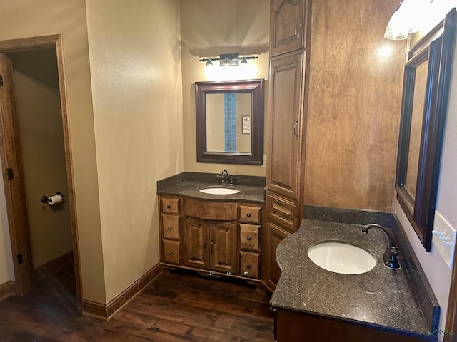 bathroom with vanity and wood-type flooring