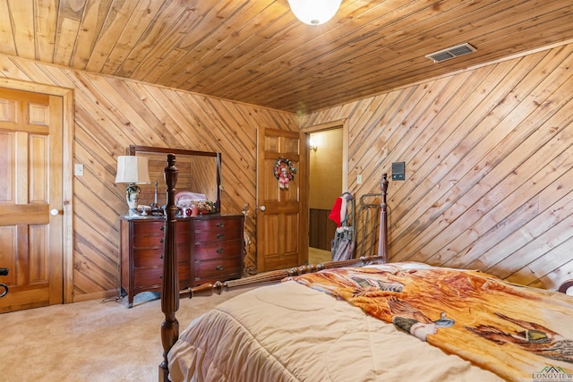 bedroom featuring carpet, wooden ceiling, and wood walls