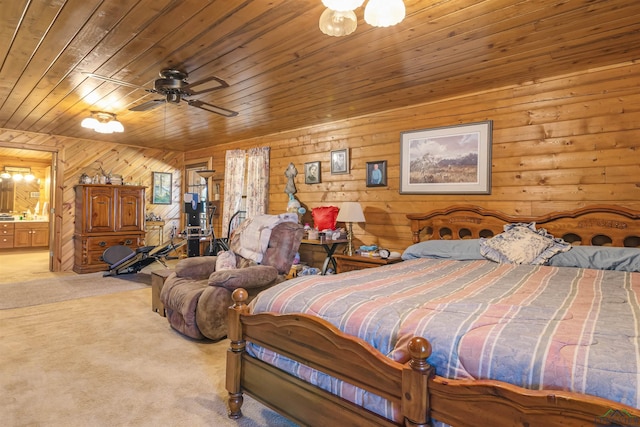 bedroom with ceiling fan, ensuite bathroom, wood ceiling, and light carpet