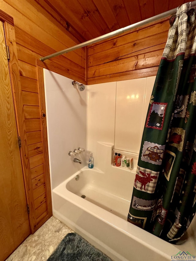 bathroom featuring wood ceiling, wooden walls, and shower / bath combination with curtain