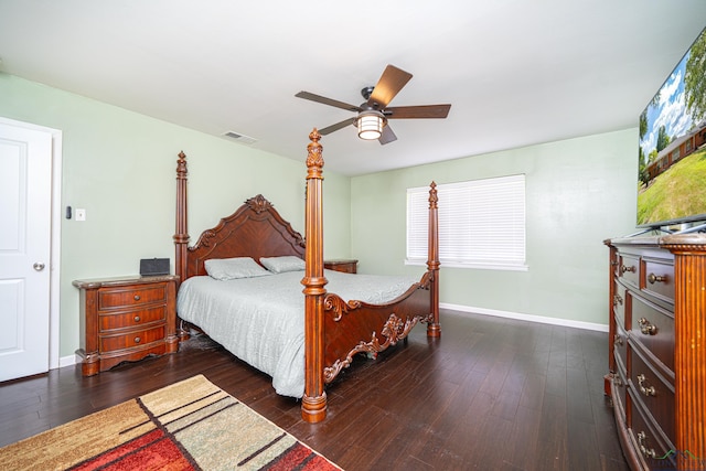 bedroom featuring dark hardwood / wood-style flooring and ceiling fan