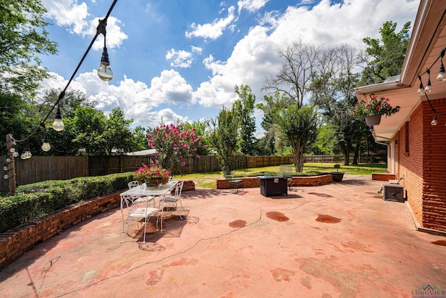 view of patio / terrace with a fire pit