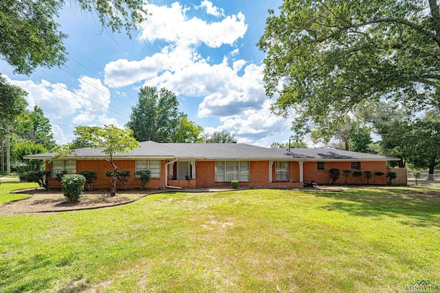 ranch-style house with a front lawn