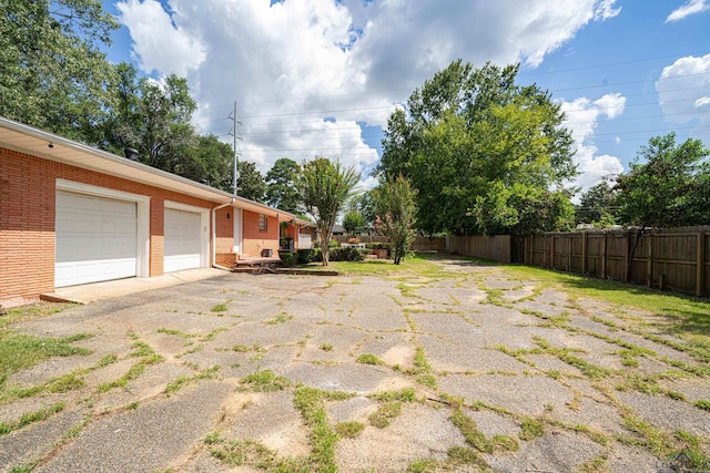 view of yard with a garage