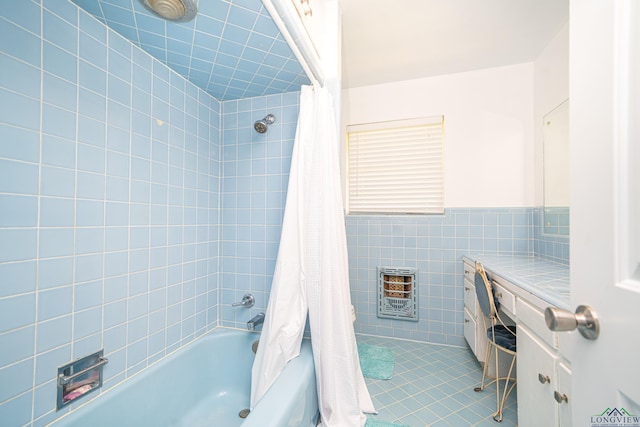 bathroom with heating unit, tile patterned flooring, shower / tub combo, and tile walls