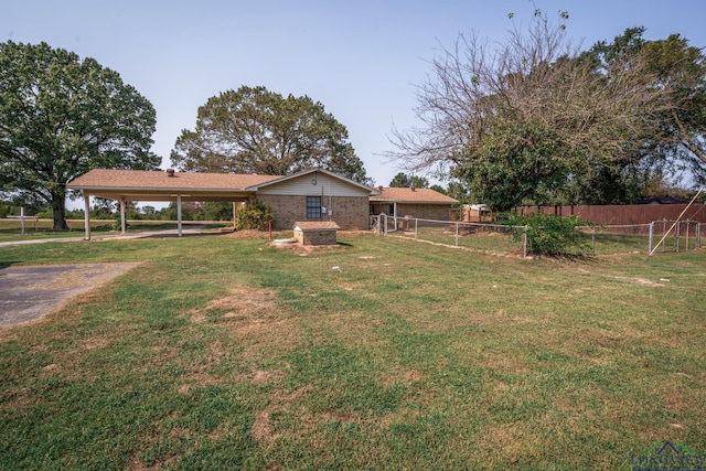 view of yard with a carport