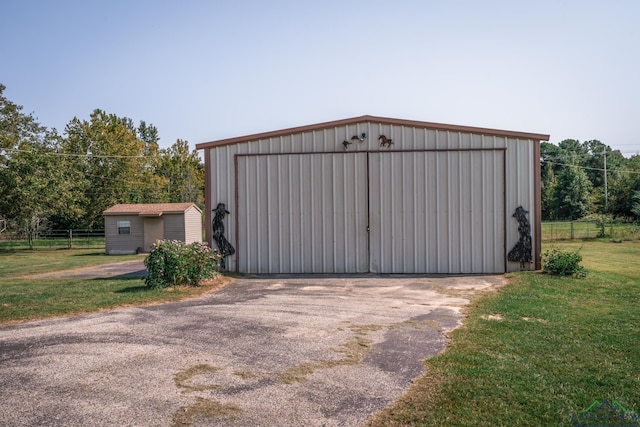 view of outdoor structure with a yard