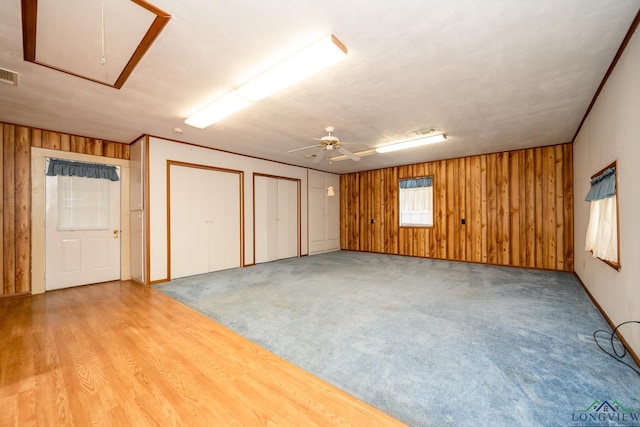 interior space featuring carpet floors and ceiling fan