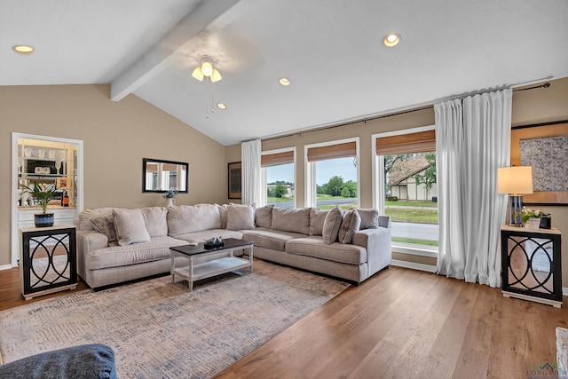 living area featuring vaulted ceiling with beams, a ceiling fan, recessed lighting, and wood finished floors