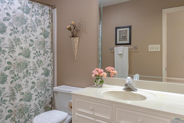 bathroom with vanity, toilet, and a shower with shower curtain