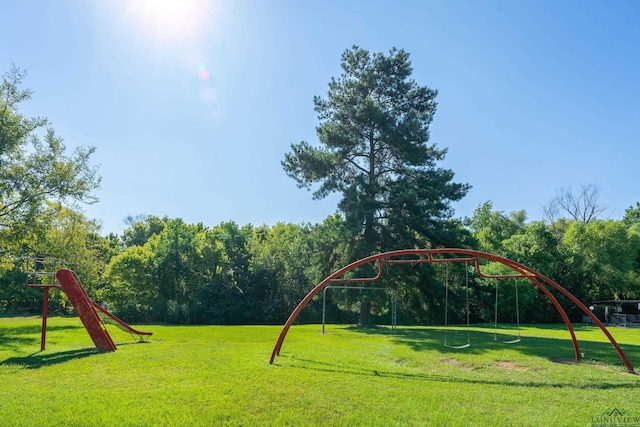 community jungle gym with a lawn