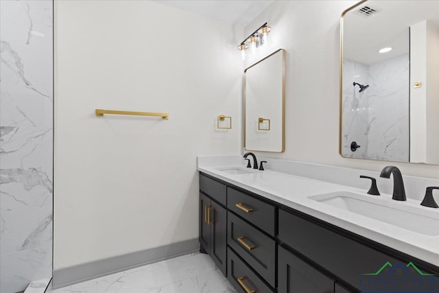 full bath with marble finish floor, a marble finish shower, visible vents, and a sink