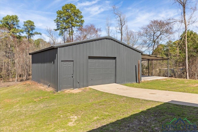 view of outbuilding with driveway and an outdoor structure