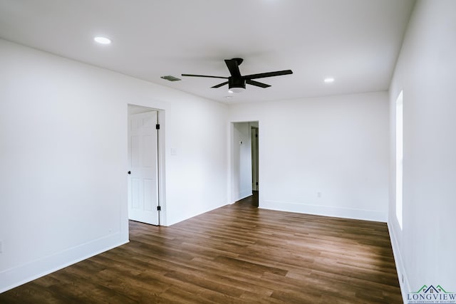 spare room featuring recessed lighting, visible vents, a ceiling fan, baseboards, and dark wood-style flooring