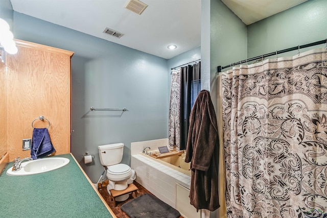 full bathroom featuring visible vents, a sink, toilet, and a bath