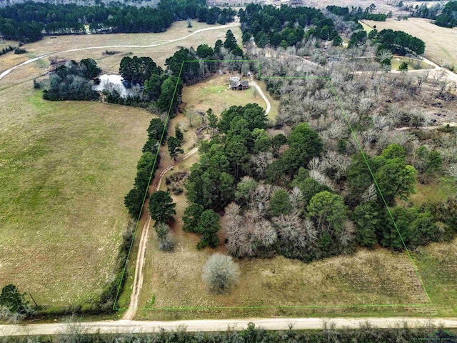 birds eye view of property with a rural view