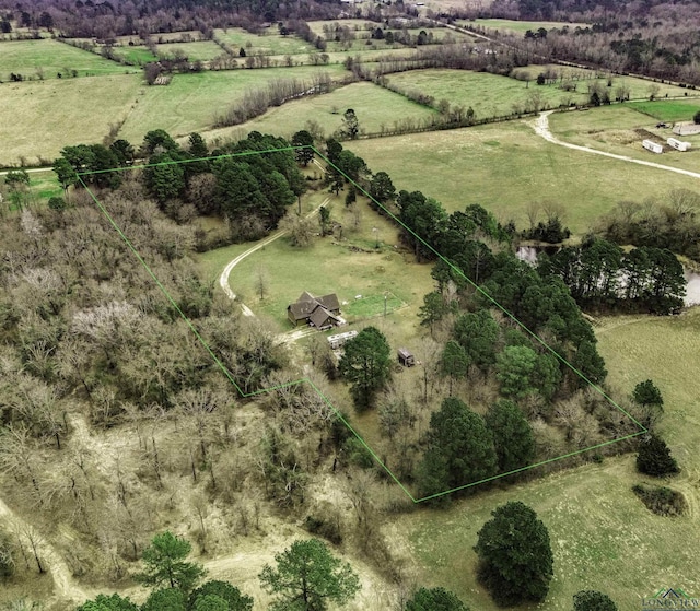 birds eye view of property with a rural view