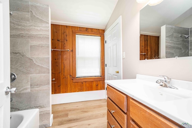 full bathroom with wood finished floors, shower / bath combination, and vanity