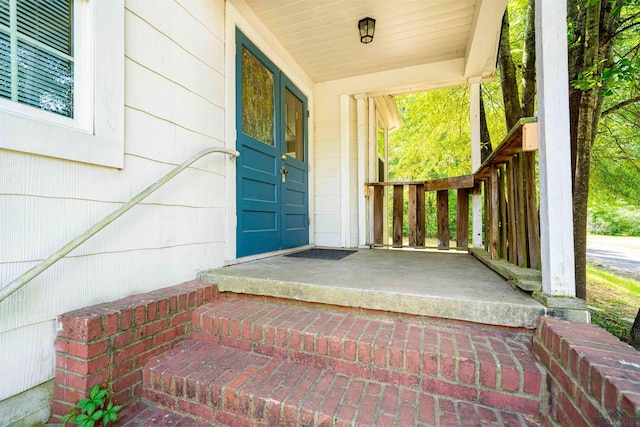 doorway to property featuring a porch