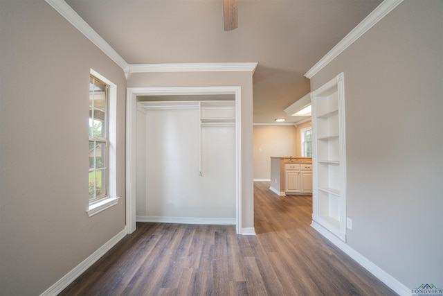 8686 Locust Rd, Big Sandy, TX 75755 - unfurnished bedroom featuring wood finished floors, multiple windows, baseboards, ornamental molding, and a closet