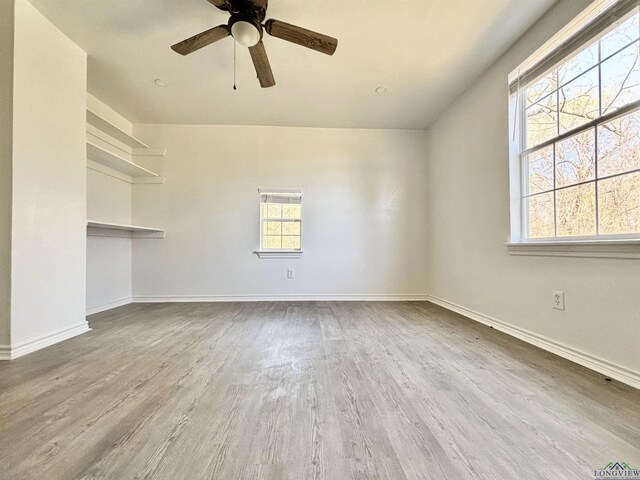 68 Eason Ln, Atlanta, TX 75551 - empty room with a ceiling fan, baseboards, and wood finished floors