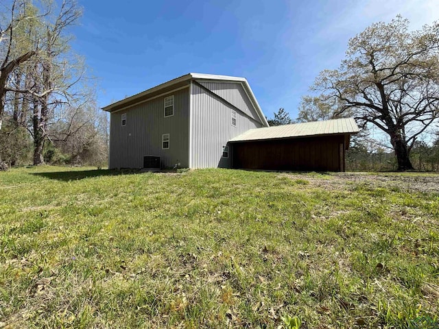 68 Eason Ln, Atlanta, TX 75551 - view of side of property with central AC and a yard