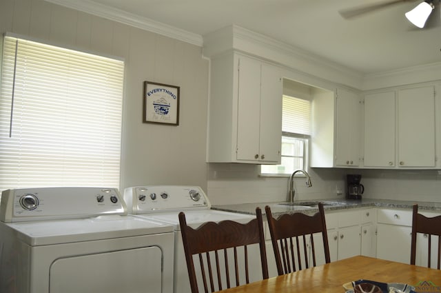 105 W Highland Ave, Longview, TX 75602 - laundry room with washing machine and clothes dryer, crown molding, and ceiling fan