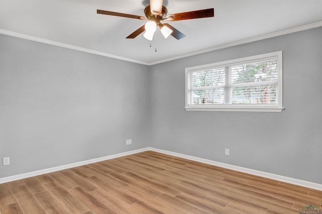 unfurnished room with light wood-style floors, ceiling fan, baseboards, and ornamental molding