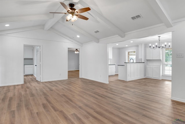 unfurnished living room featuring light wood-type flooring, lofted ceiling with beams, visible vents, and ceiling fan with notable chandelier