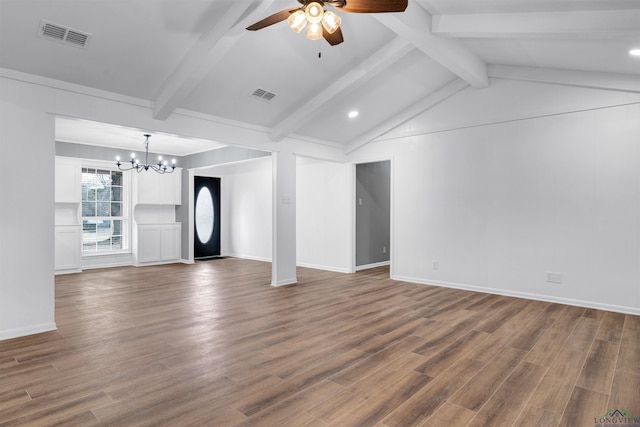 empty room featuring dark wood-style floors, visible vents, and vaulted ceiling with beams