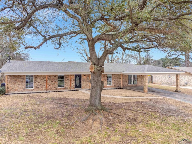 single story home with brick siding and roof with shingles