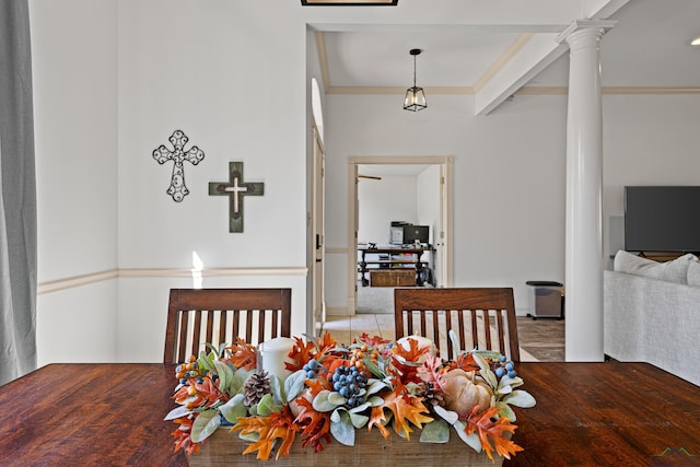 dining area featuring decorative columns