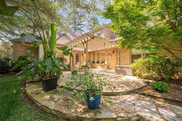 108 Fountainebleau Ave, Longview, TX 75605 - back of house with a pergola, brick siding, and a patio area