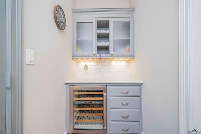 108 Fountainebleau Ave, Longview, TX 75605 - bar with beverage cooler and tasteful backsplash