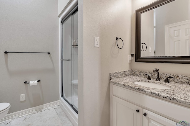 4300 Willow Bnd, Longview, TX 75602 - full bath featuring toilet, vanity, a stall shower, and baseboards
