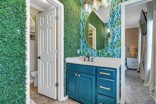 4300 Willow Bnd, Longview, TX 75602 - bathroom with wallpapered walls, vanity, crown molding, toilet, and baseboards