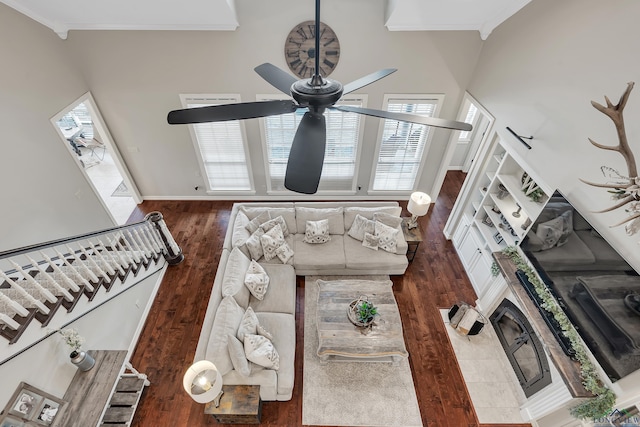 4300 Willow Bnd, Longview, TX 75602 - living area with a ceiling fan, wood finished floors, stairway, crown molding, and baseboards